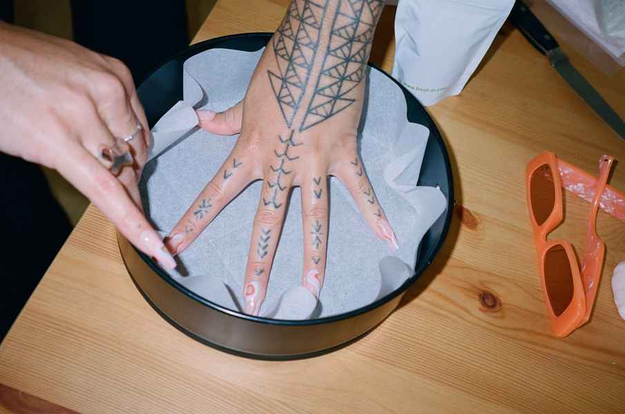 Lemon Strawberry Poppy Seed Cake KitEditorial Image of person making cake