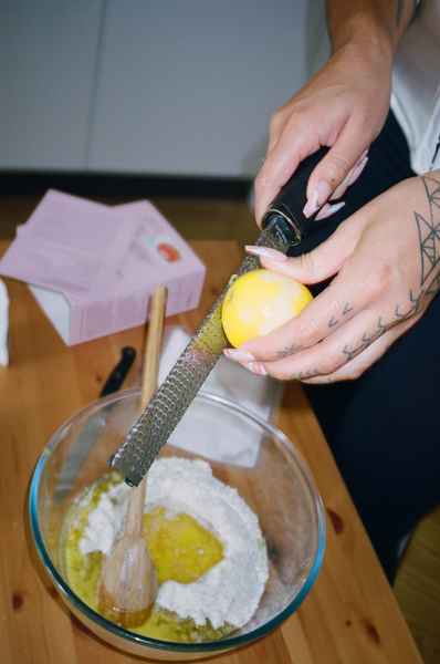 Lemon Strawberry Poppy Seed Cake KitEditorial Image of person making cake