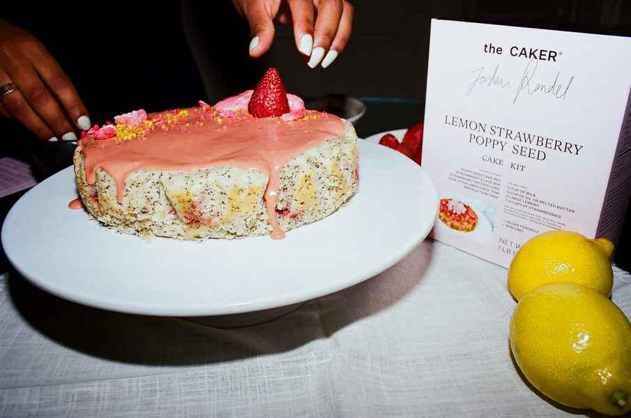 Lemon Strawberry Poppy Seed Cake KitEditorial Image of person making cake