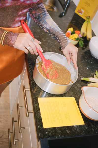 WHOLESALE Banana Cinnamon Cake Kit - (6 Unit Case)Editorial Image of person making cake