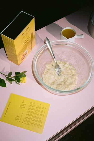 WHOLESALE Banana Cinnamon Cake Kit - (6 Unit Case)Editorial Image of person making cake