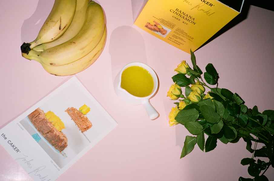 WHOLESALE Banana Cinnamon Cake Kit - (6 Unit Case)Editorial Image of person making cake