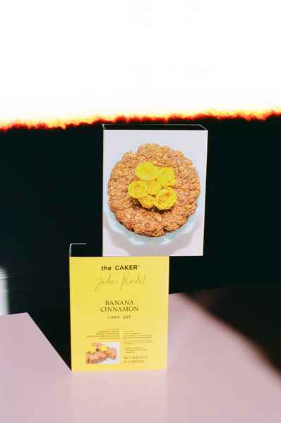 WHOLESALE Banana Cinnamon Cake Kit - (6 Unit Case)Editorial Image of person making cake