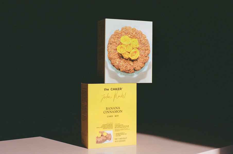 WHOLESALE Banana Cinnamon Cake Kit - (6 Unit Case)Editorial Image of person making cake
