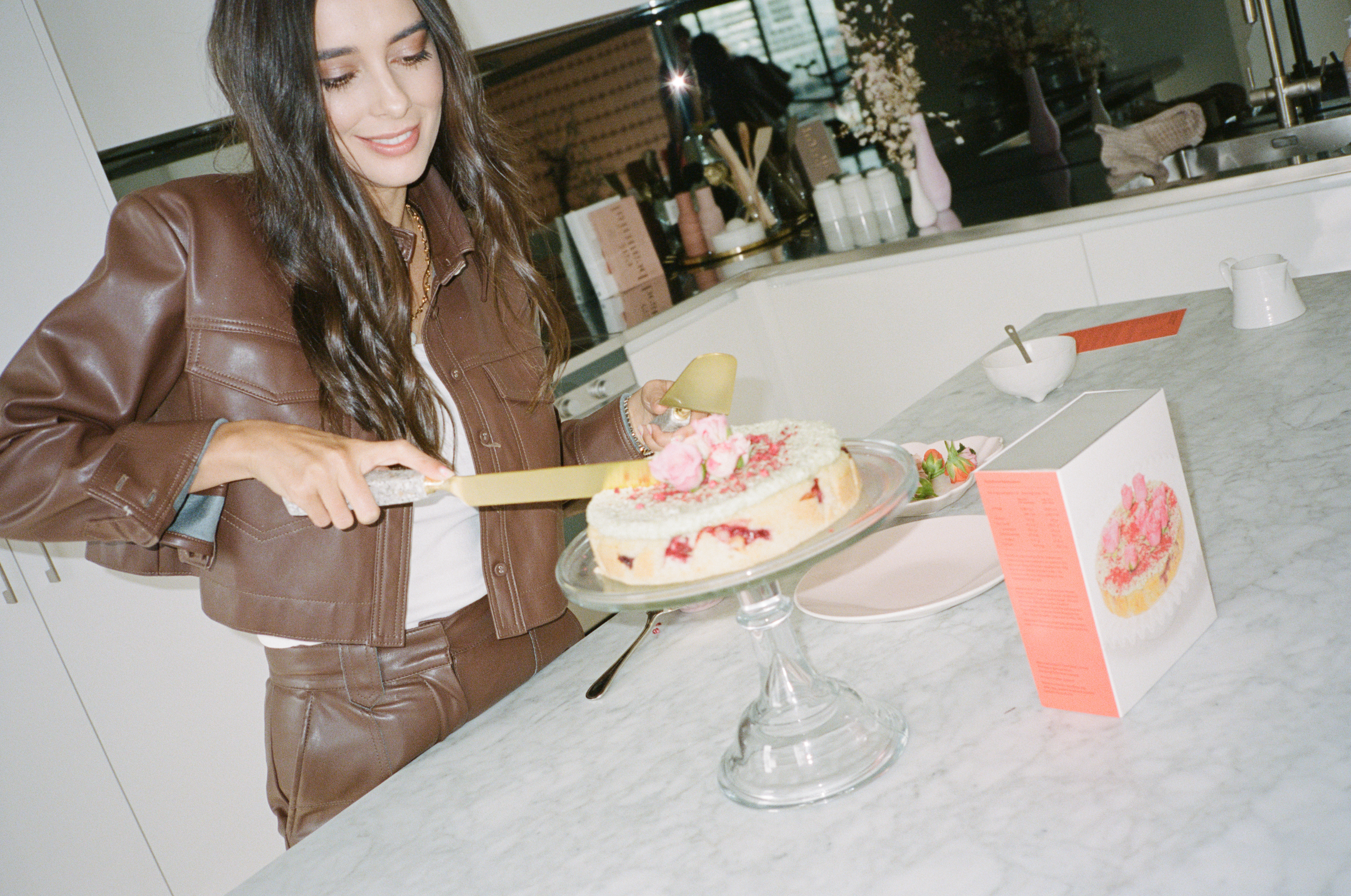 Coconut Raspberry Lime Leaf Cake KitEditorial Image of person making cake