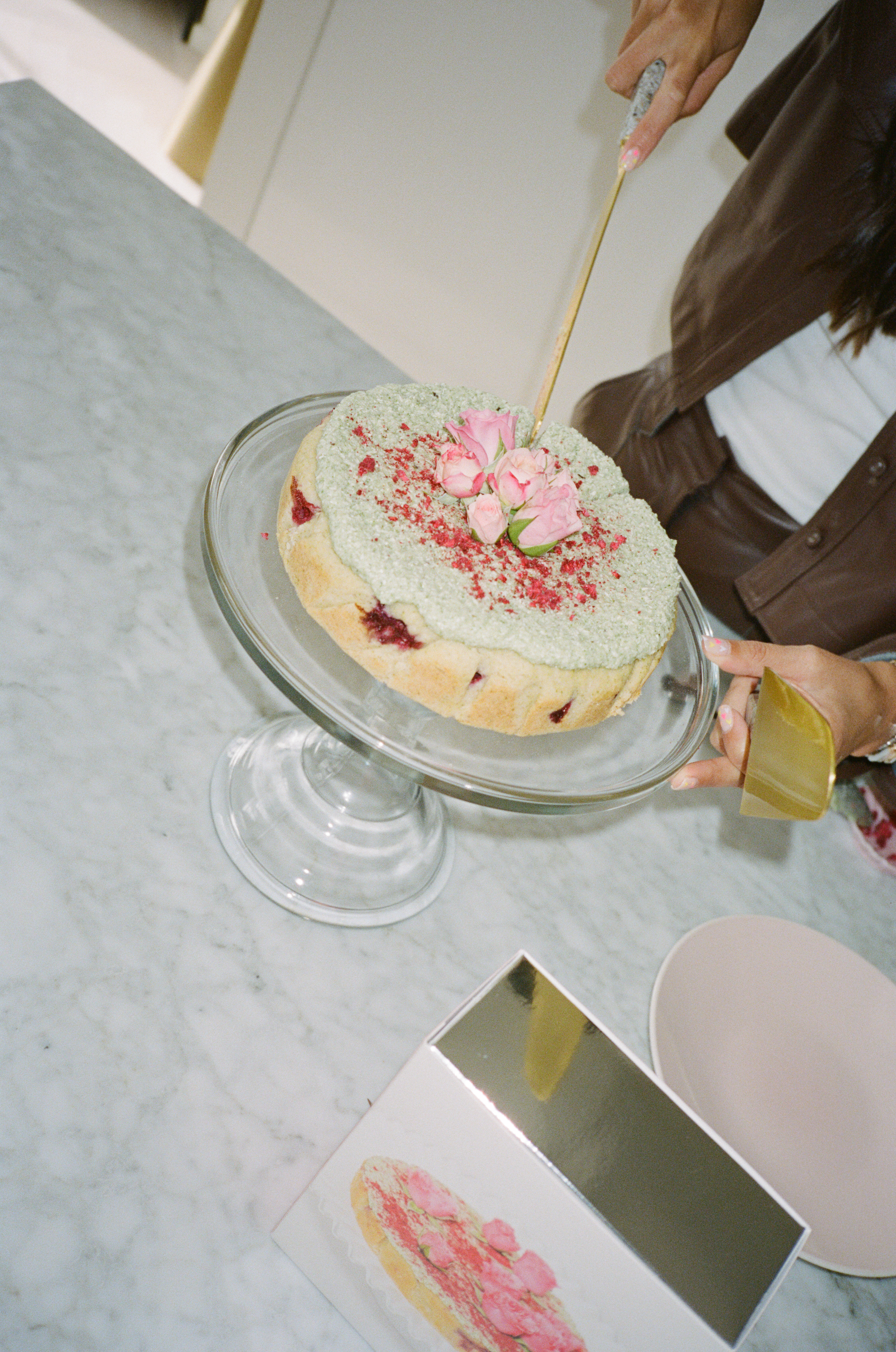 Coconut Raspberry Lime Leaf Cake KitEditorial Image of person making cake