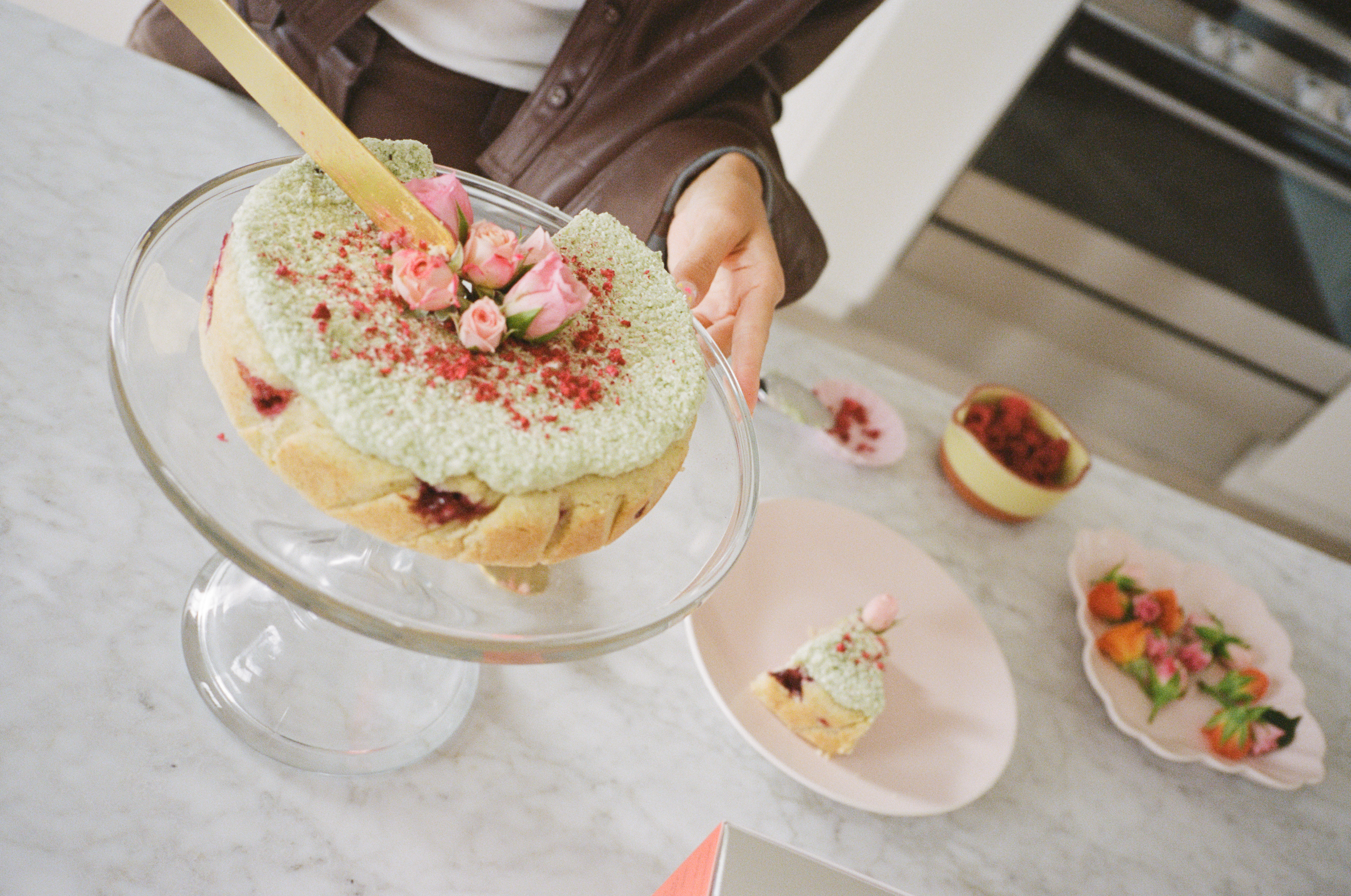 Coconut Raspberry Lime Leaf Cake KitEditorial Image of person making cake
