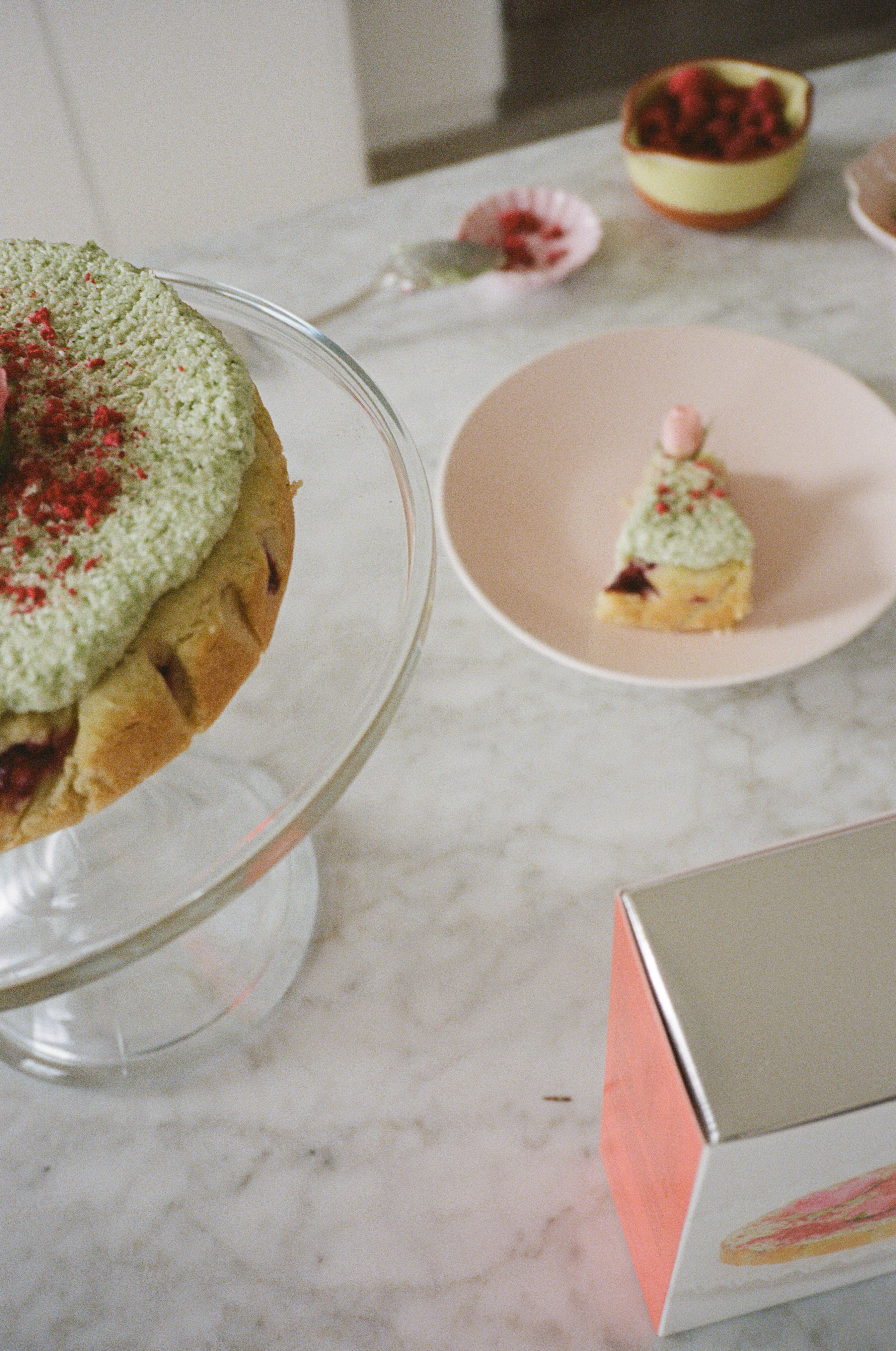 Coconut Raspberry Lime Leaf Cake KitEditorial Image of person making cake
