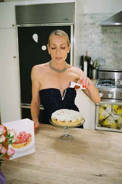 Coconut Raspberry Lime Leaf Cake KitEditorial Image of person making cake