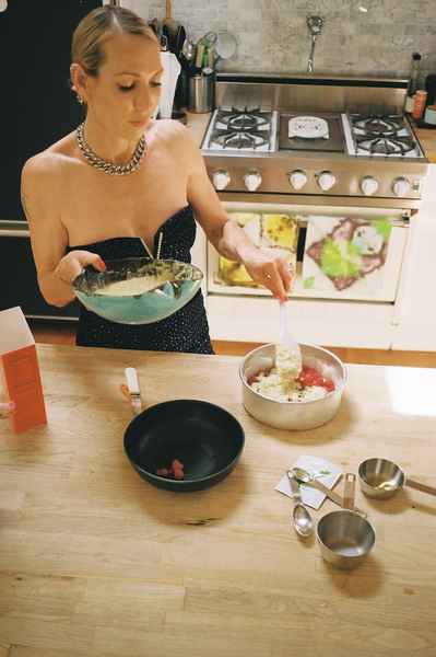 Coconut Raspberry Lime Leaf Cake KitEditorial Image of person making cake