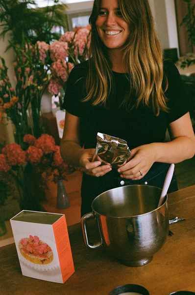 Coconut Raspberry Lime Leaf Cake KitEditorial Image of person making cake