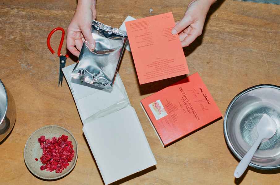 Coconut Raspberry Lime Leaf Cake KitEditorial Image of person making cake