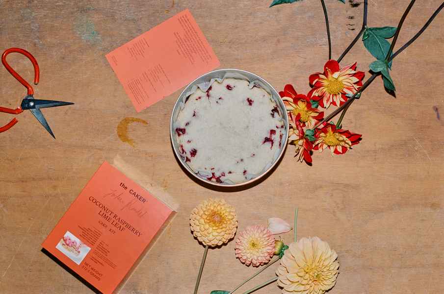 Coconut Raspberry Lime Leaf Cake KitEditorial Image of person making cake