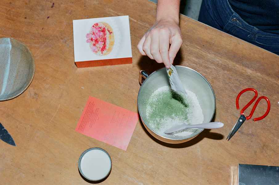 Coconut Raspberry Lime Leaf Cake KitEditorial Image of person making cake