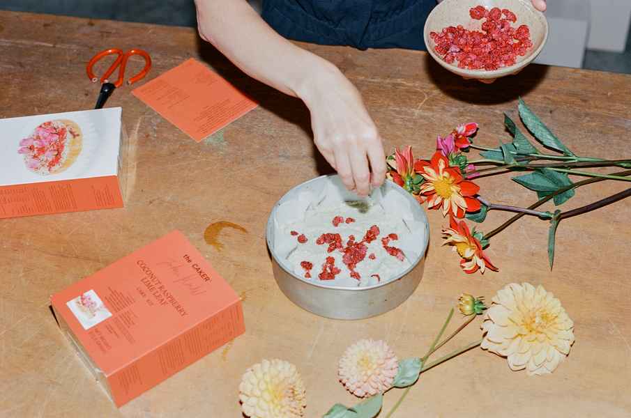 Coconut Raspberry Lime Leaf Cake KitEditorial Image of person making cake
