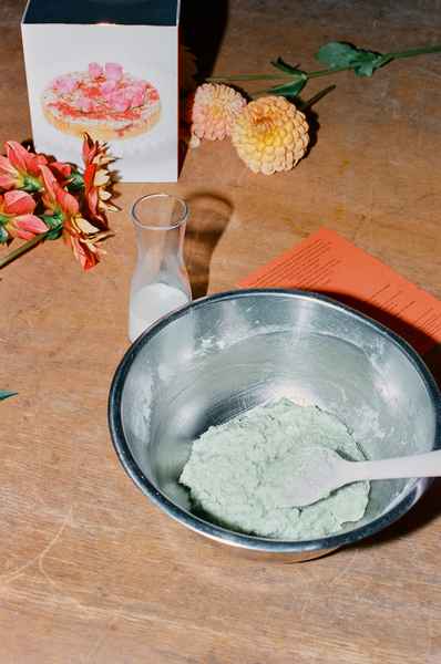 Coconut Raspberry Lime Leaf Cake KitEditorial Image of person making cake