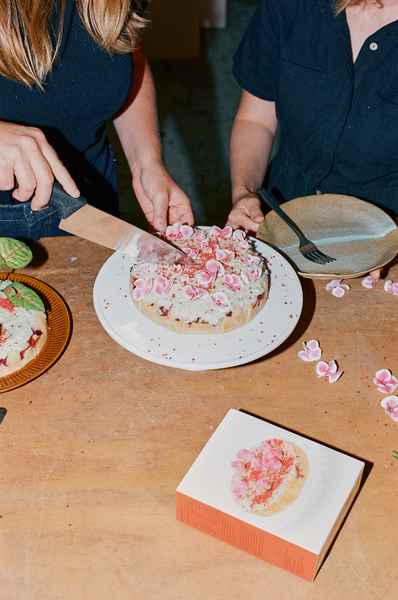 Coconut Raspberry Lime Leaf Cake KitEditorial Image of person making cake