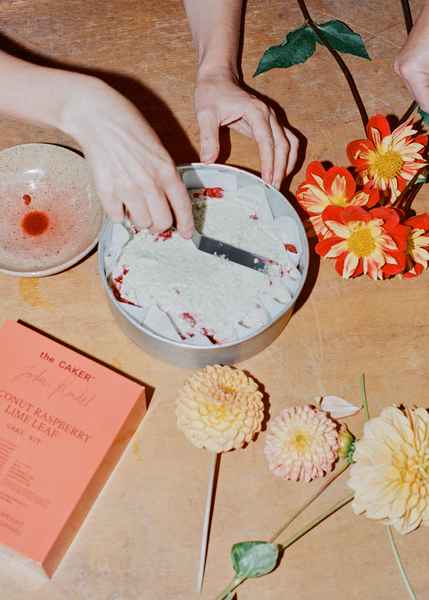 Coconut Raspberry Lime Leaf Cake KitEditorial Image of person making cake