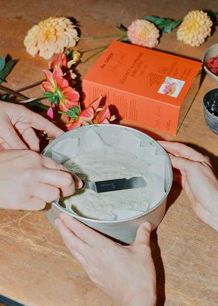 Coconut Raspberry Lime Leaf Cake KitEditorial Image of person making cake
