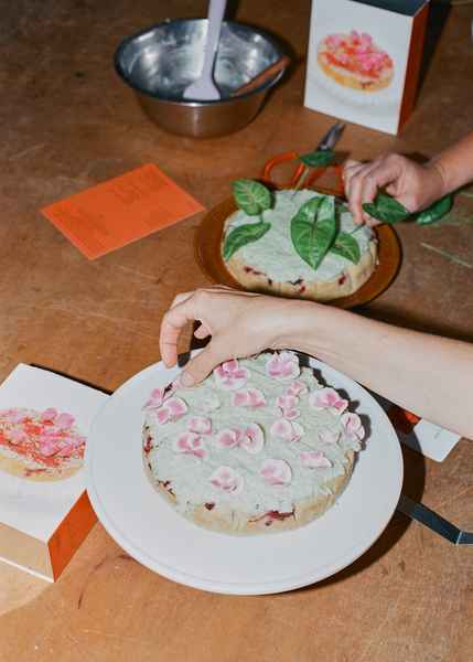 Coconut Raspberry Lime Leaf Cake KitEditorial Image of person making cake