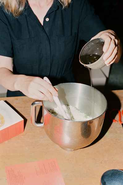 Coconut Raspberry Lime Leaf Cake KitEditorial Image of person making cake