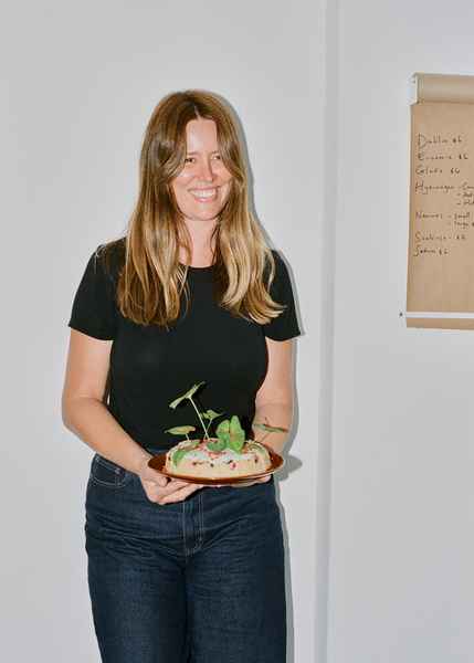 Coconut Raspberry Lime Leaf Cake KitEditorial Image of person making cake