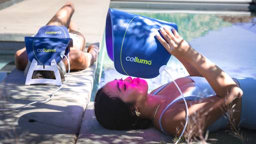 Girl using the Celluma PRO outside by the pool on the aging mode with red light therapy.