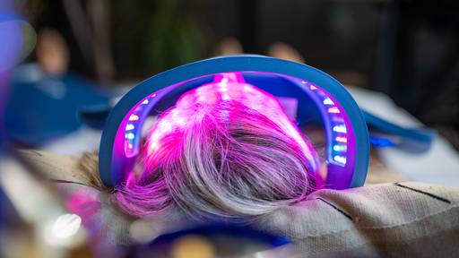 Women laying outside getting an Aging treatment over the face for wrinkle and fine line reduction.