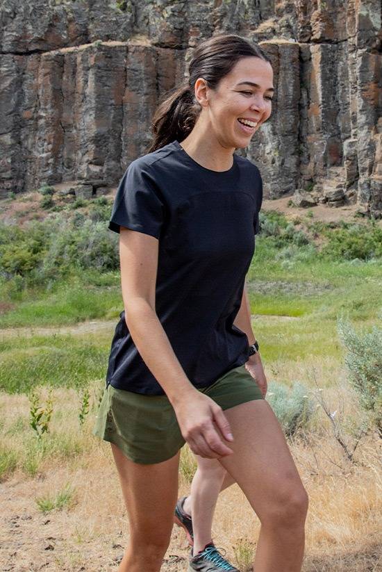 Women hiking and smiling while wearing the Feathers Tech-T by Beyond Clothing. 