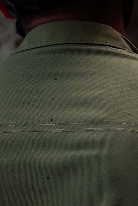 Close up image of the Evergreen colored FirstSun Shirt showcasing the ventilation holes in the upper back.