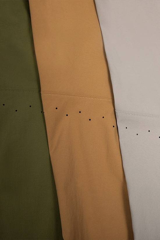 Close up photo of the TarnGood Pant showing the ventilation holes. Three colors featured: Evergreen, Tobacco and Moonstone.