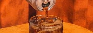 Close up shot of Rootbeer being poured over ice
