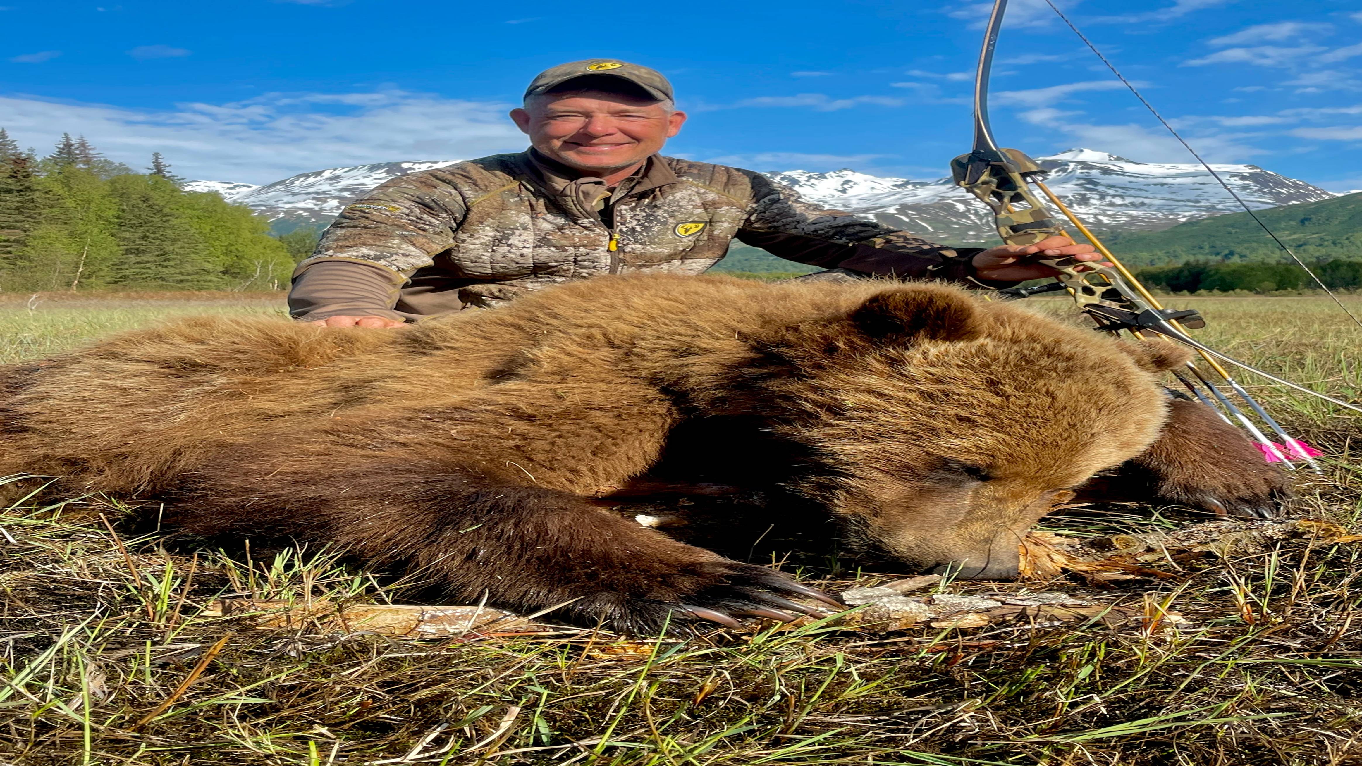 Fred Eicher using Fred Eichler Signature Series Riser Bow to harvest Cinnamon Phase Bear