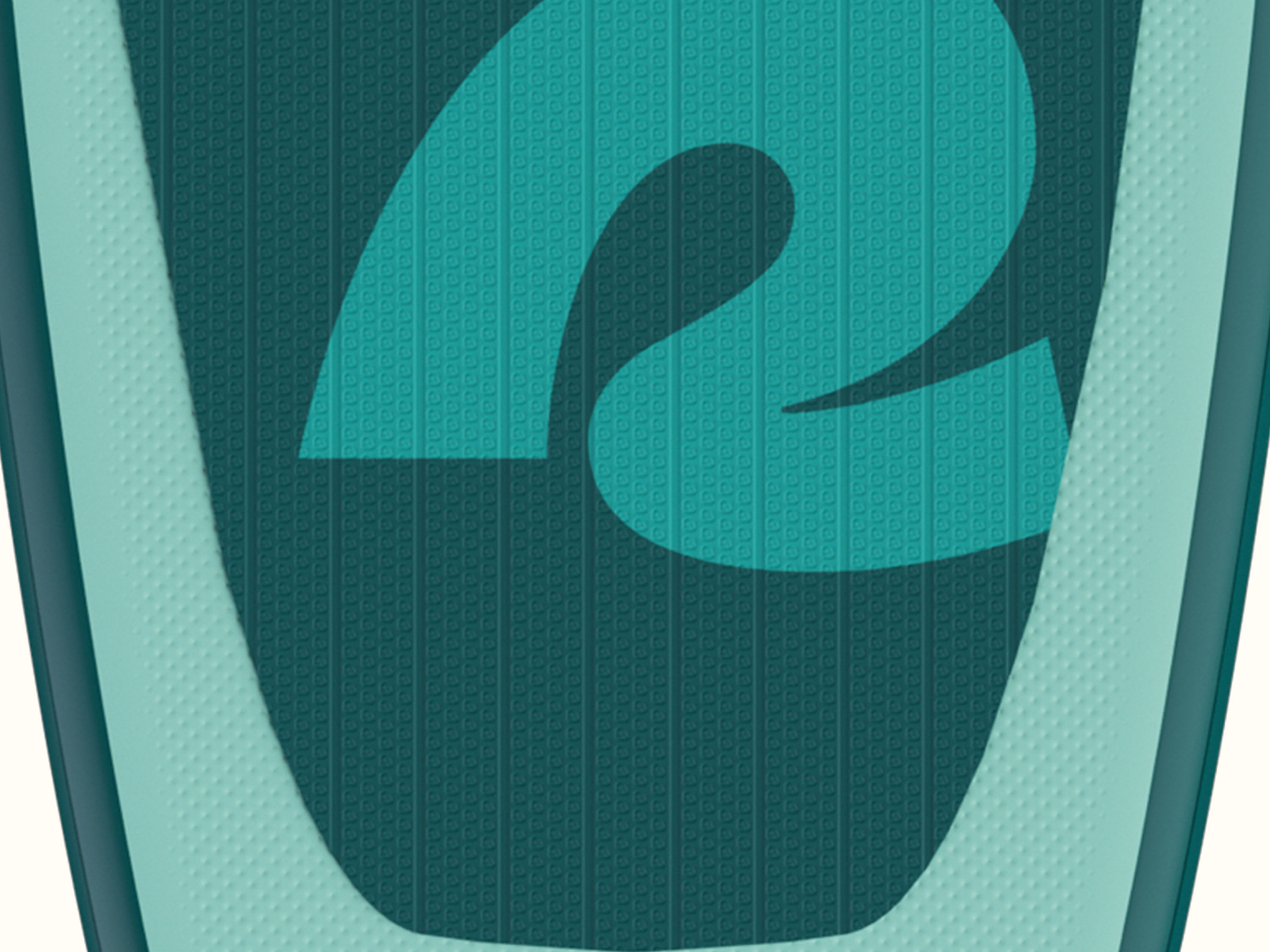 A close-up of the deck pad on the Weekender Nano Kids' Inflatable Stand Up Paddleboard highlighting its texture.