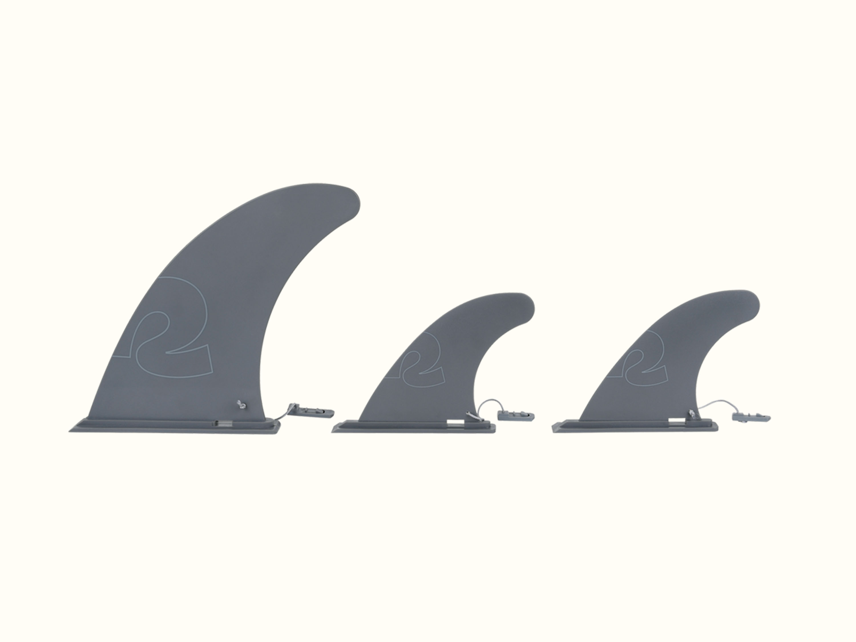 A set of three grey paddleboard slide-in fins.