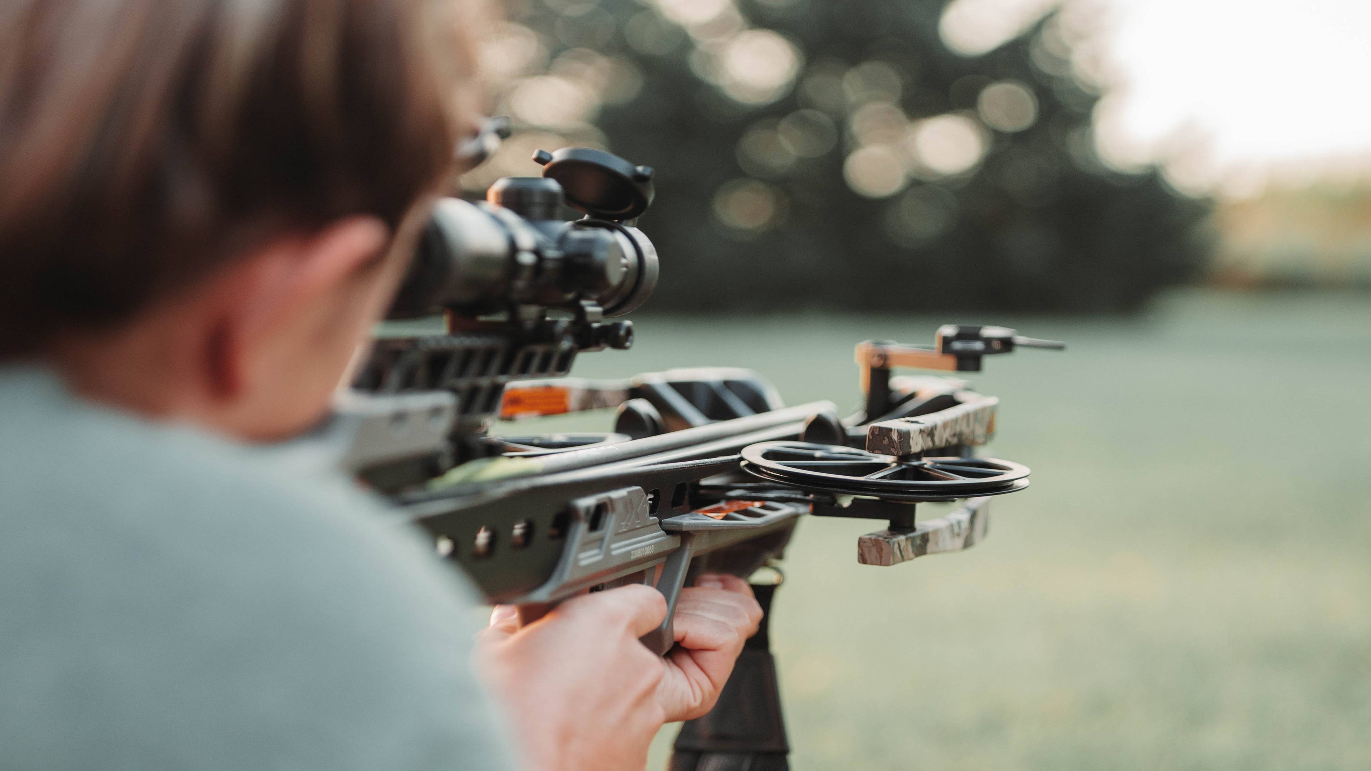 Woman about to shoot a Bear Archery Constrictor Pro Hunting Crossbow