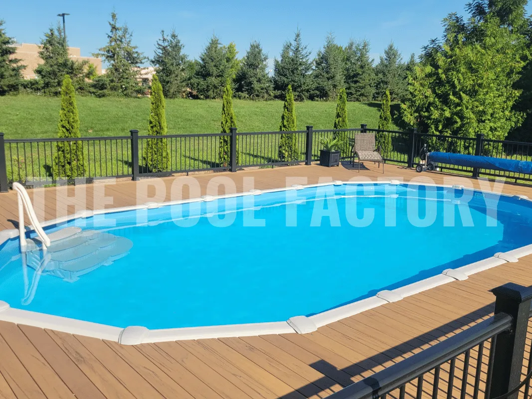 Modern backyard with oval above ground swimming pool and sleek composite decking
