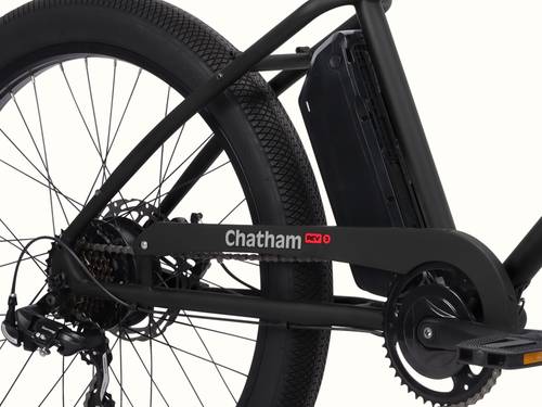 Close-up of the Chatham Rev 3 Beach Cruiser Electric Bike's battery and rear wheel.