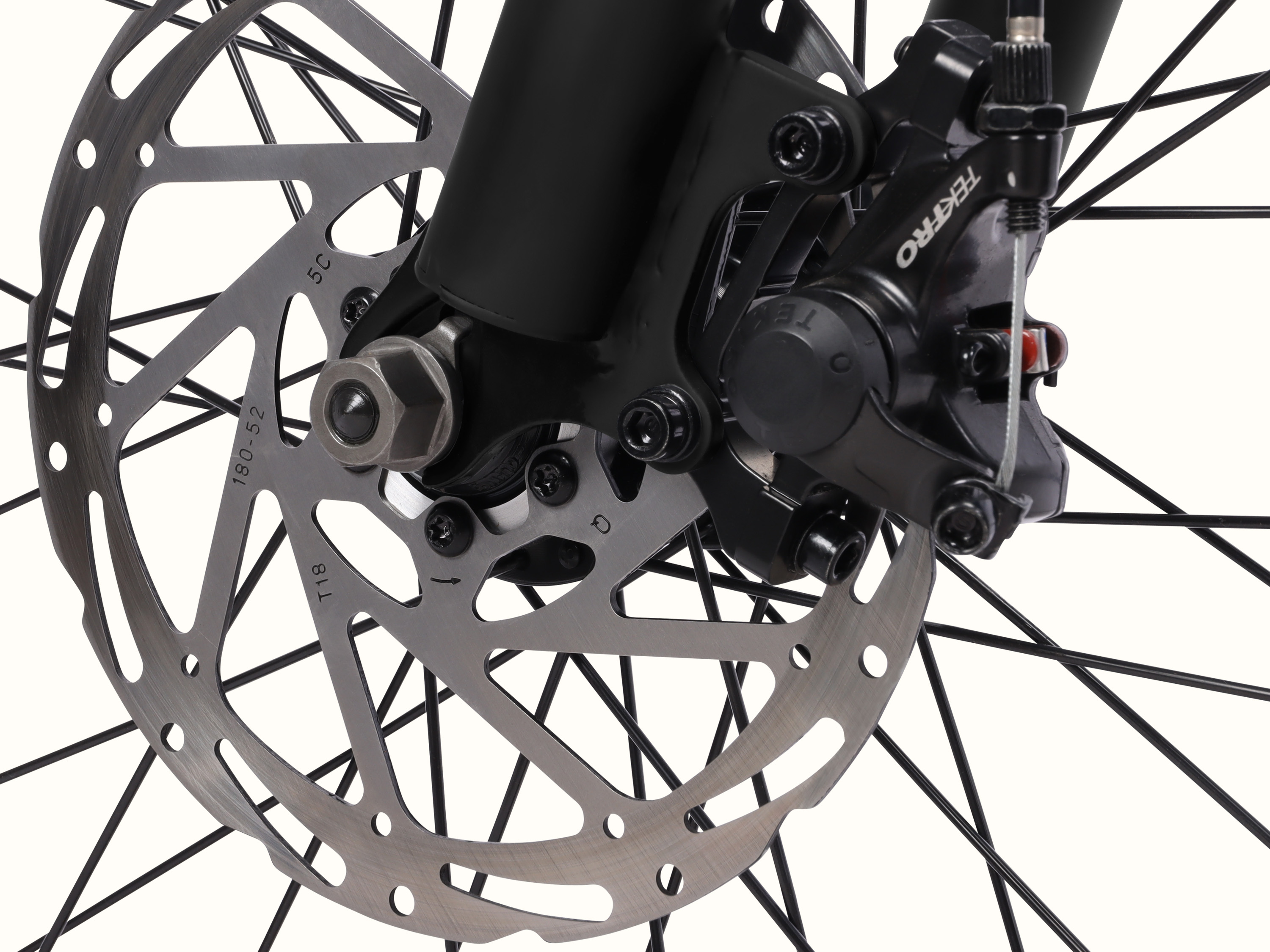 Close-up of the Chatham Rev 3 Beach Cruiser Electric Bike's Tektro mechanical disc brakes.