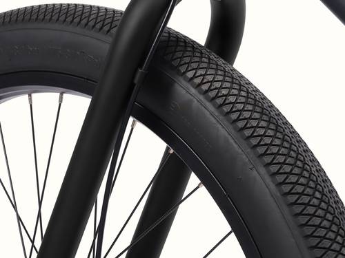 Close-up of the Chatham Rev 3 Beach Cruiser Electric Bike's tire highlighting its width and grip.