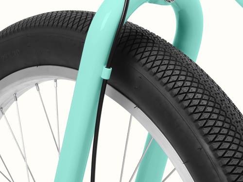 A close-up of the Seafoam Chatham Rev 3 Beach Cruiser Electric Bike's tire showcasing its grip and width.