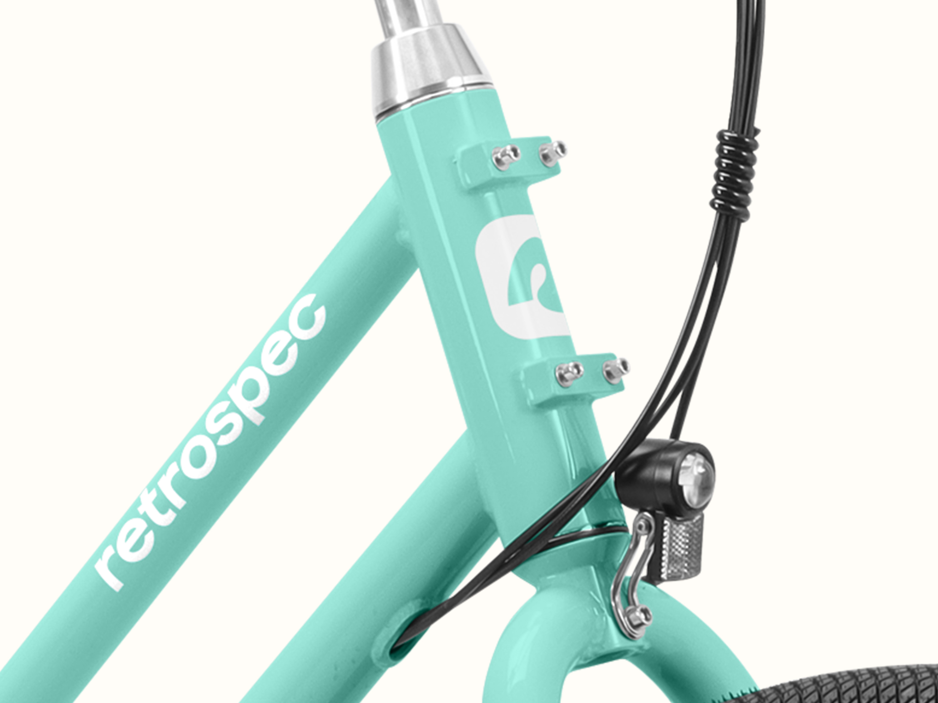 A close-up of the Seafoam Chatham Rev 3 Beach Cruiser Electric Bike's stem with mounting points.