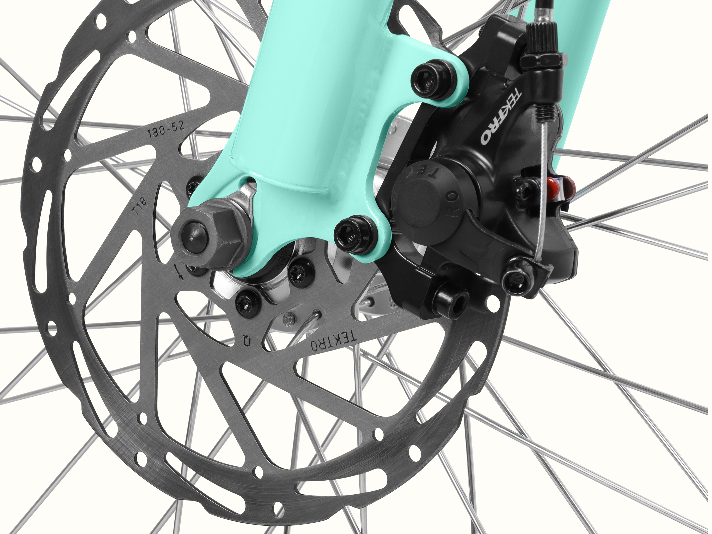 A close-up of the Seafoam Chatham Rev 3 Beach Cruiser Electric Bike's Tektro mechanical disc brakes.