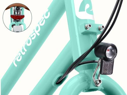 A close-up of the Seafoam Chatham Rev 3 Beach Cruiser Electric Bike's headlight and taillight.