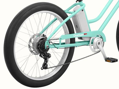 A close-up of the Seafoam Chatham Rev 3 Beach Cruiser Electric Bike's removal rear wheel system.