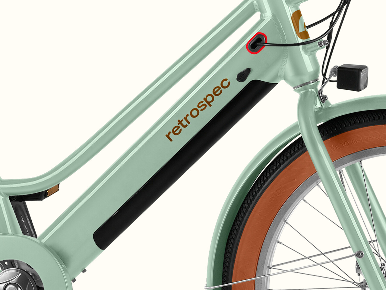 Close-up of a mint green Chatham Rev+ 2 Beach Cruiser Electric Bike - Step Through's frame featuring the 