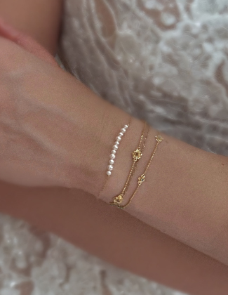 On figure bridal jewelry featuring a gold bracelets