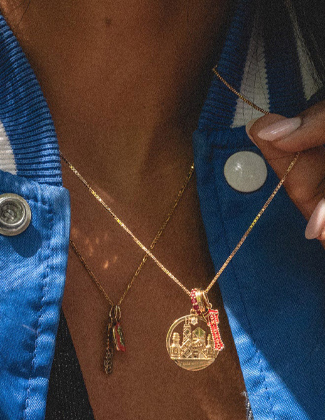 Close up of a gold charm necklace