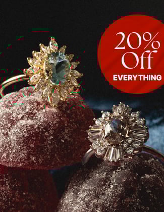 Two gold rings sitting atop gummy candy with a badge that reads 20% off