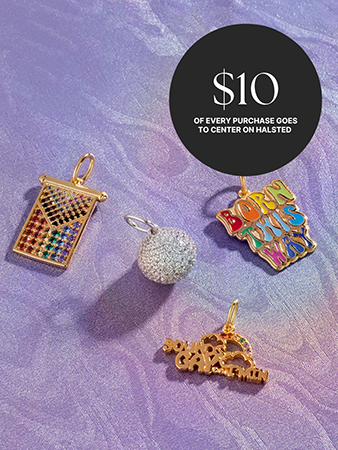 gemstone and gold charms on an iridescent marbled purple background